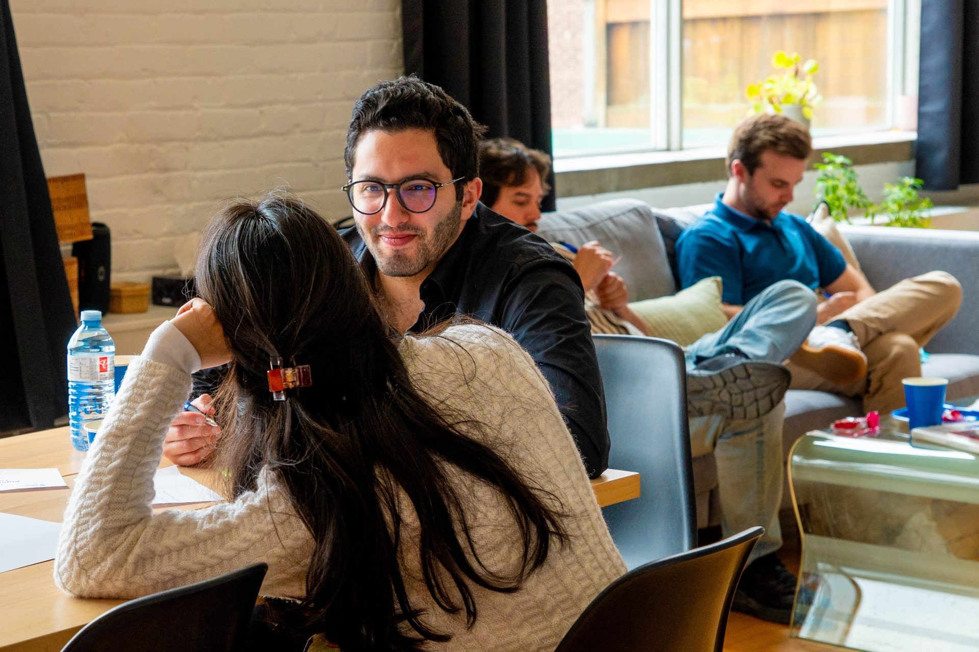 Attendees in conversation at a table